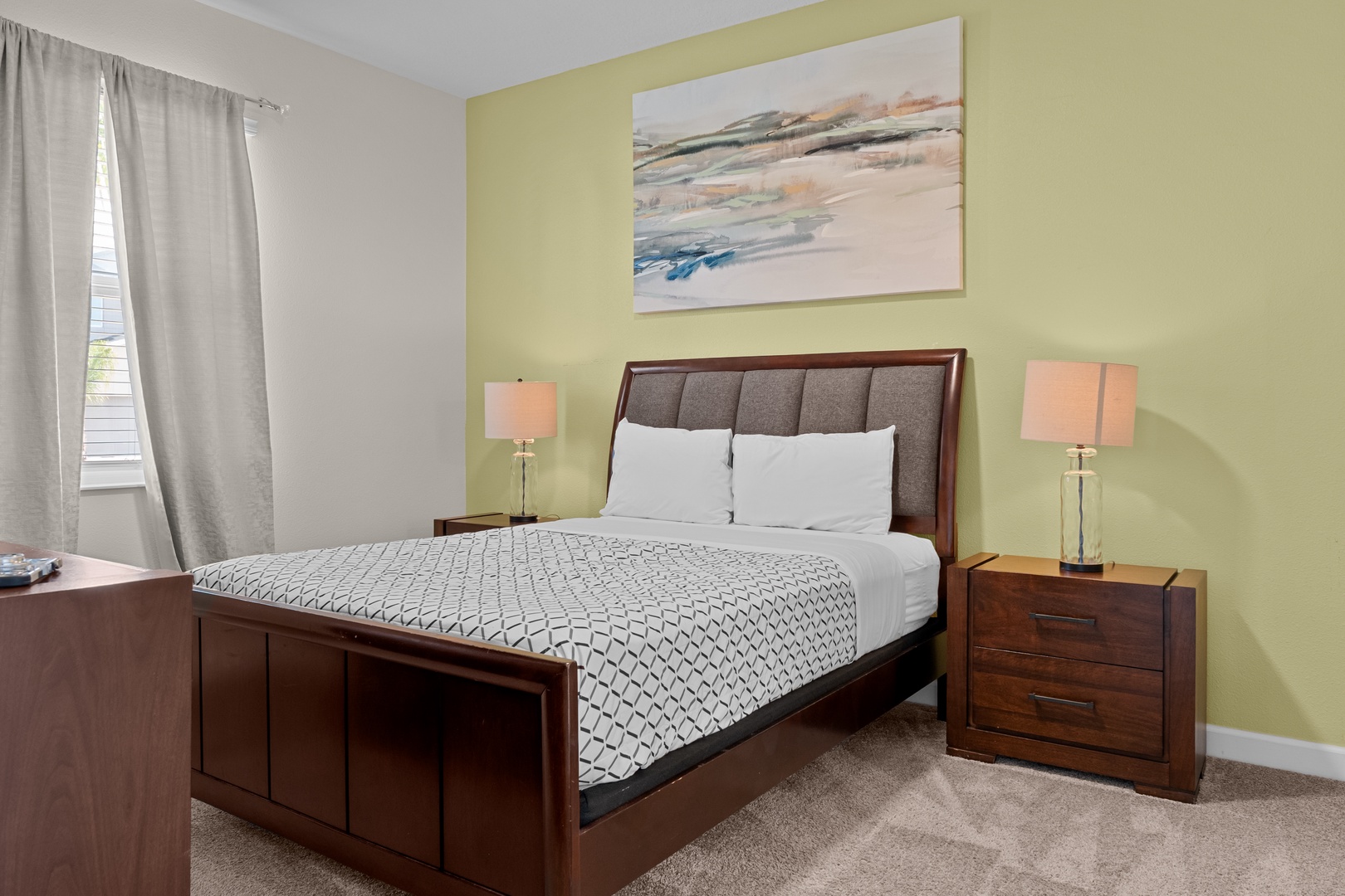 Sink into this comfortable queen bed with crisp linens and soft lighting for your perfect night's rest.