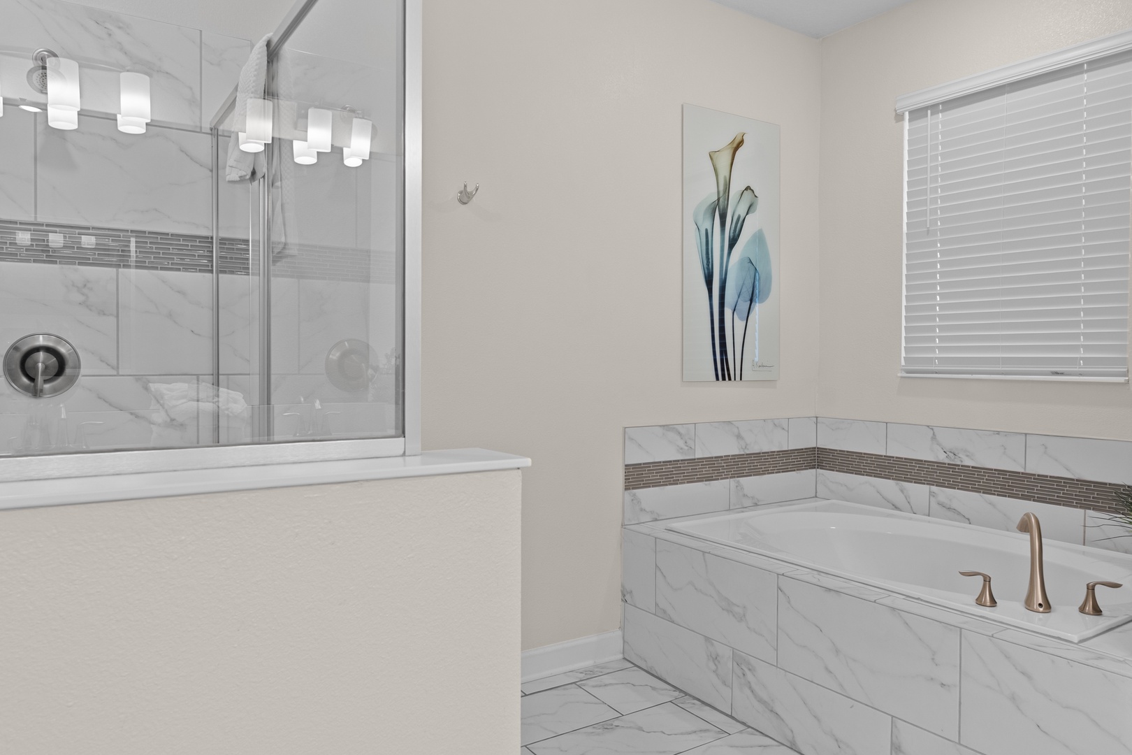 Unwind in your spa-like bathroom with a luxurious soaking tub and elegant glass shower - your private retreat awaits.