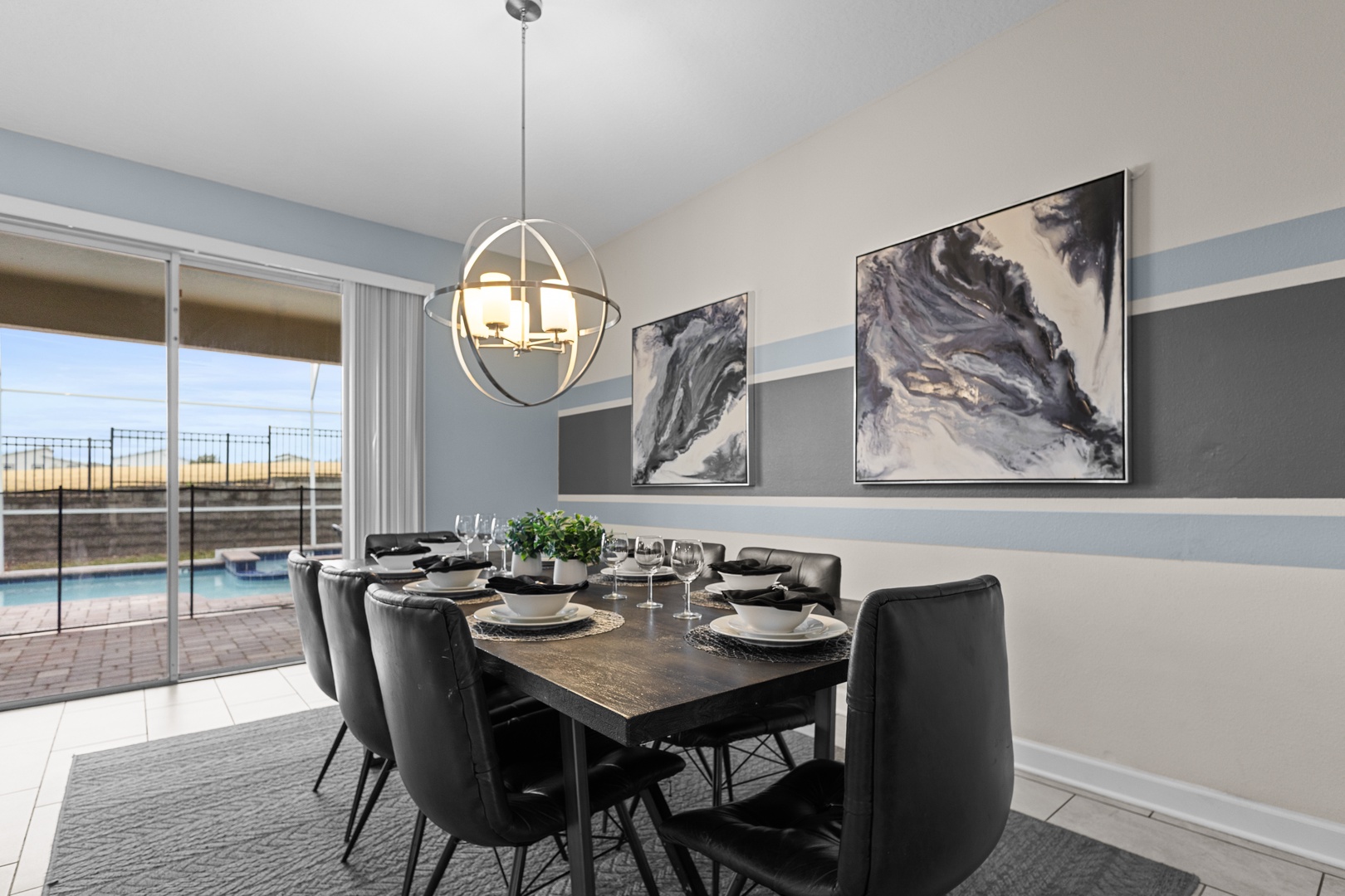 Gather around your elegant dining table, where modern art meets sophisticated comfort for memorable meals with loved ones.