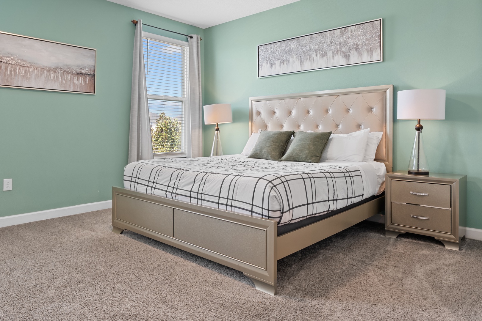Rest peacefully in your elegant bedroom with plush tufted headboard, soft linens, and calming mint walls that create the perfect sanctuary.