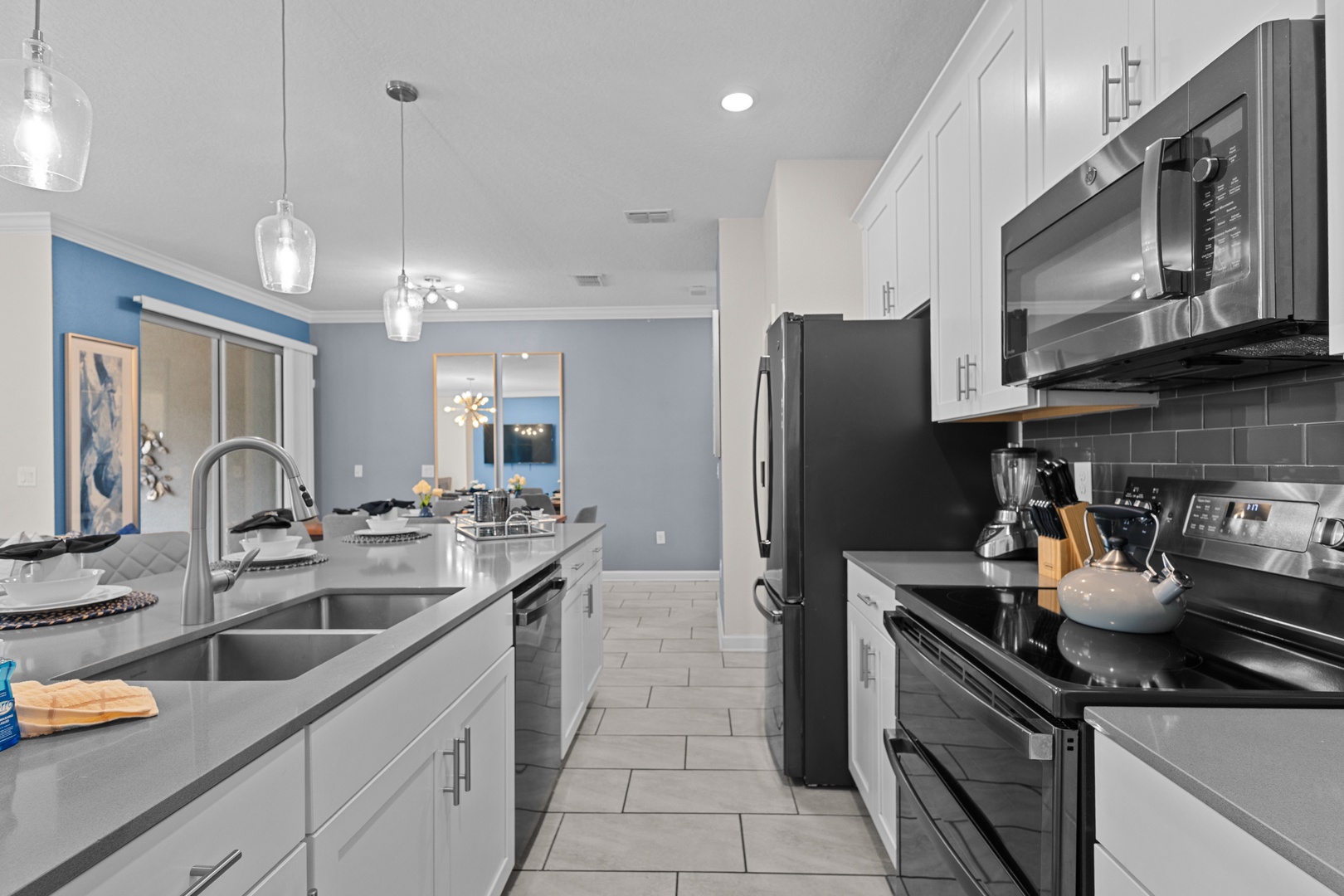 Your modern kitchen awaits with sleek stainless steel appliances, spacious granite counters, and stylish pendant lighting for memorable meal prep.