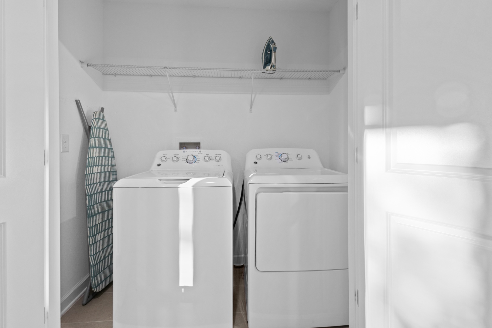 Your dedicated laundry space makes extended stays effortless with full-size washer and dryer, plus convenient ironing setup.