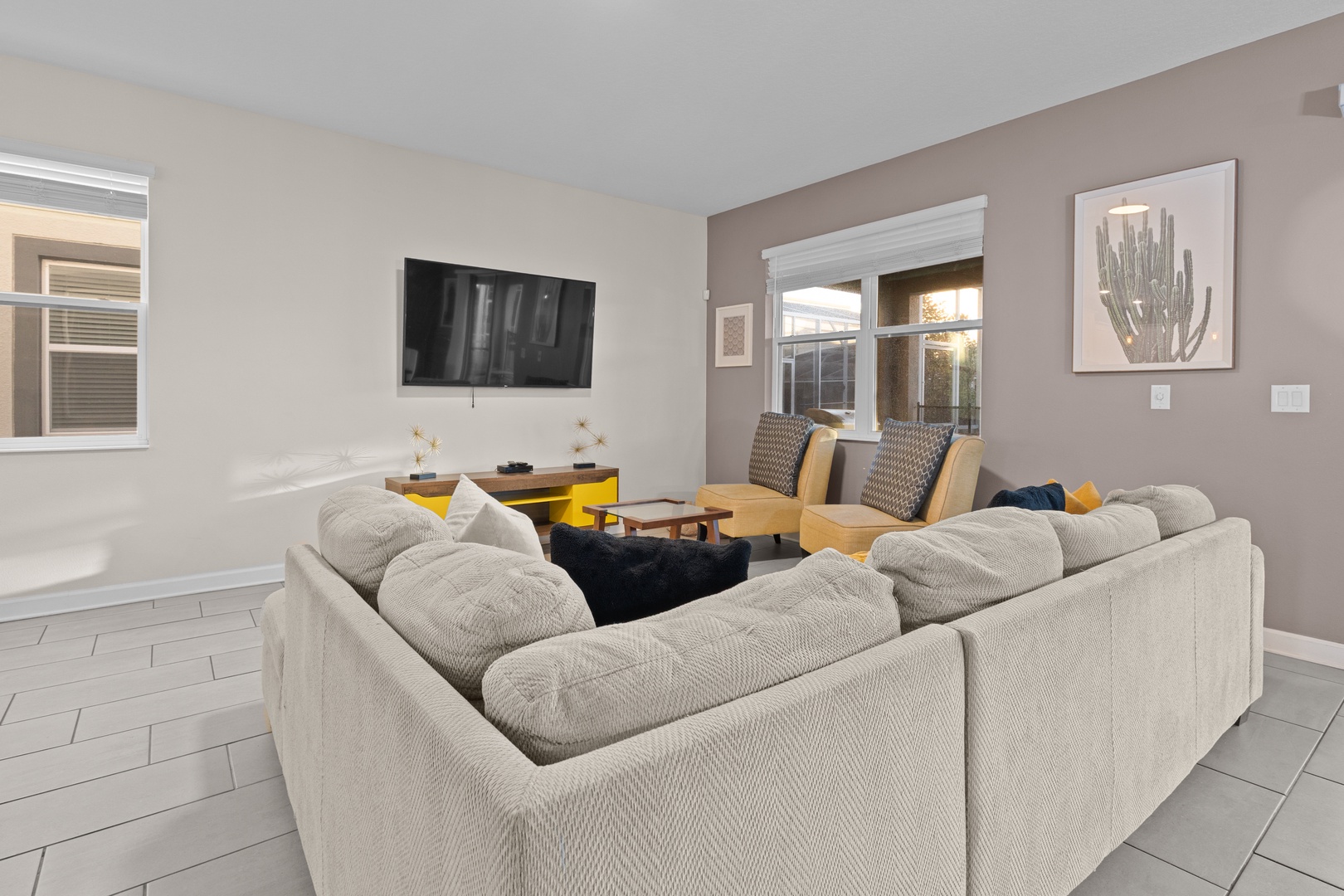 Settle into your spacious living room where plush seating and modern touches create the perfect spot for relaxing after your adventures.