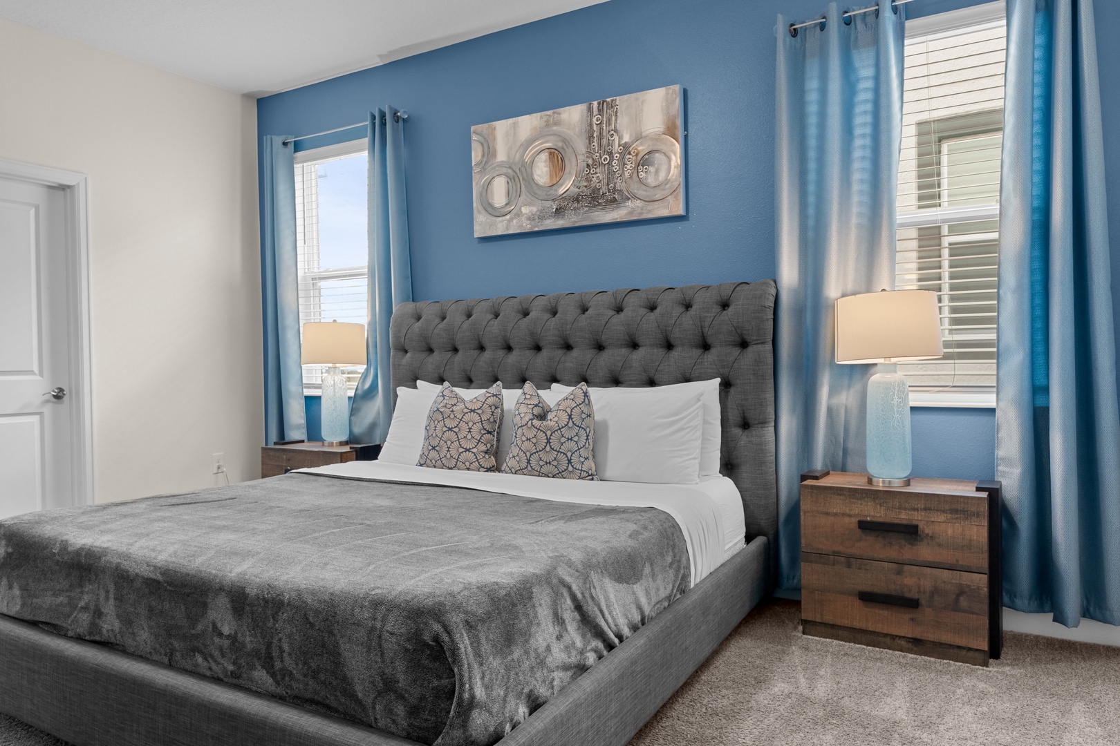 Rest peacefully in your calming bedroom with plush tufted headboard, soft linens, and soothing blue accents creating the perfect sanctuary.