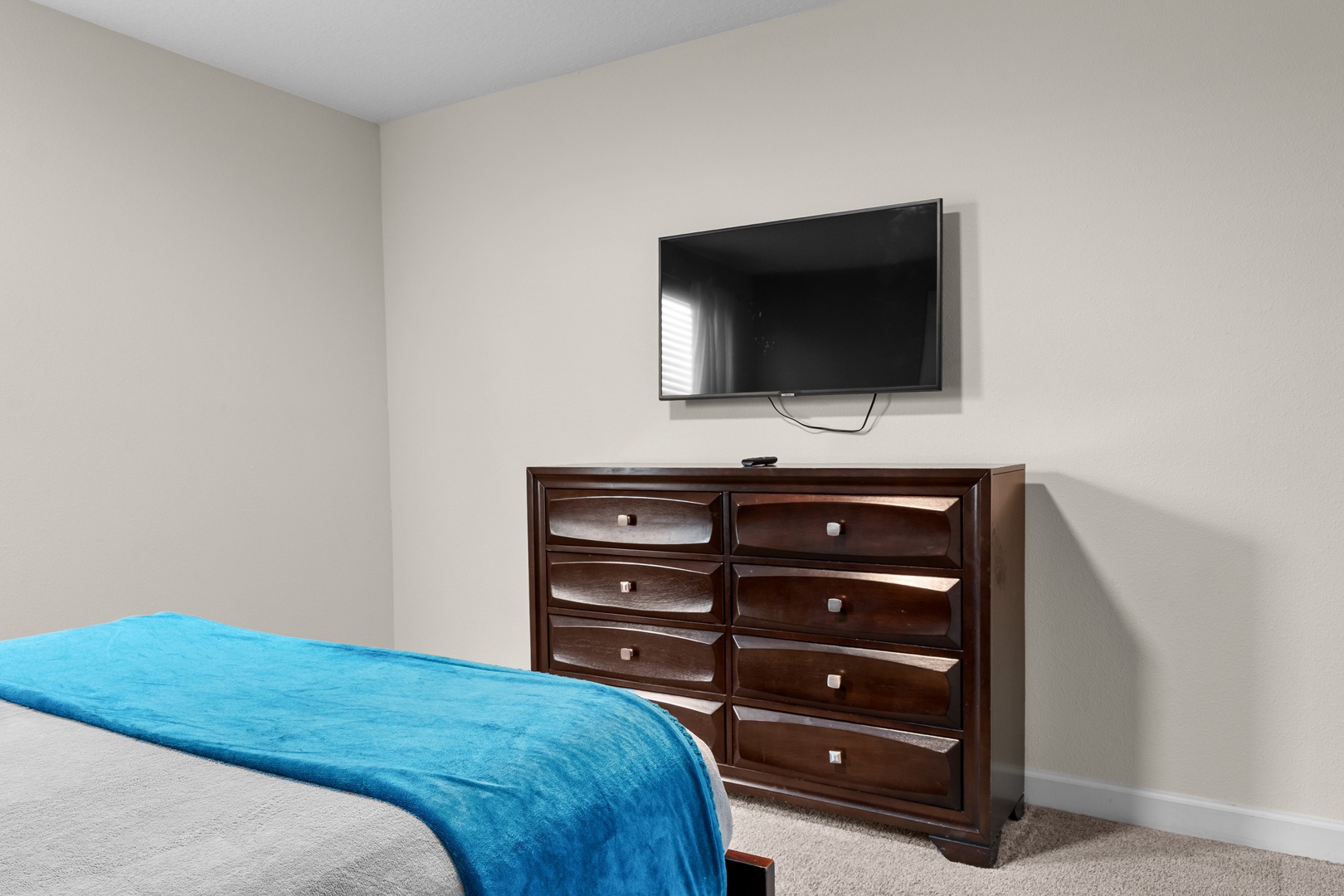 Unwind in your peaceful bedroom with a wall-mounted TV for entertainment and generous dresser storage for all your belongings.
