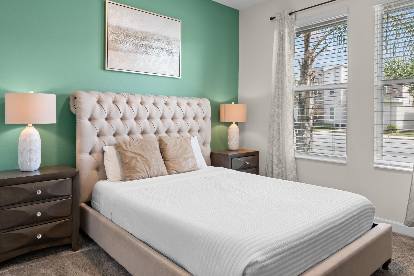 Sink into your plush tufted bed surrounded by soothing mint walls and soft lighting for the perfect night's rest.
