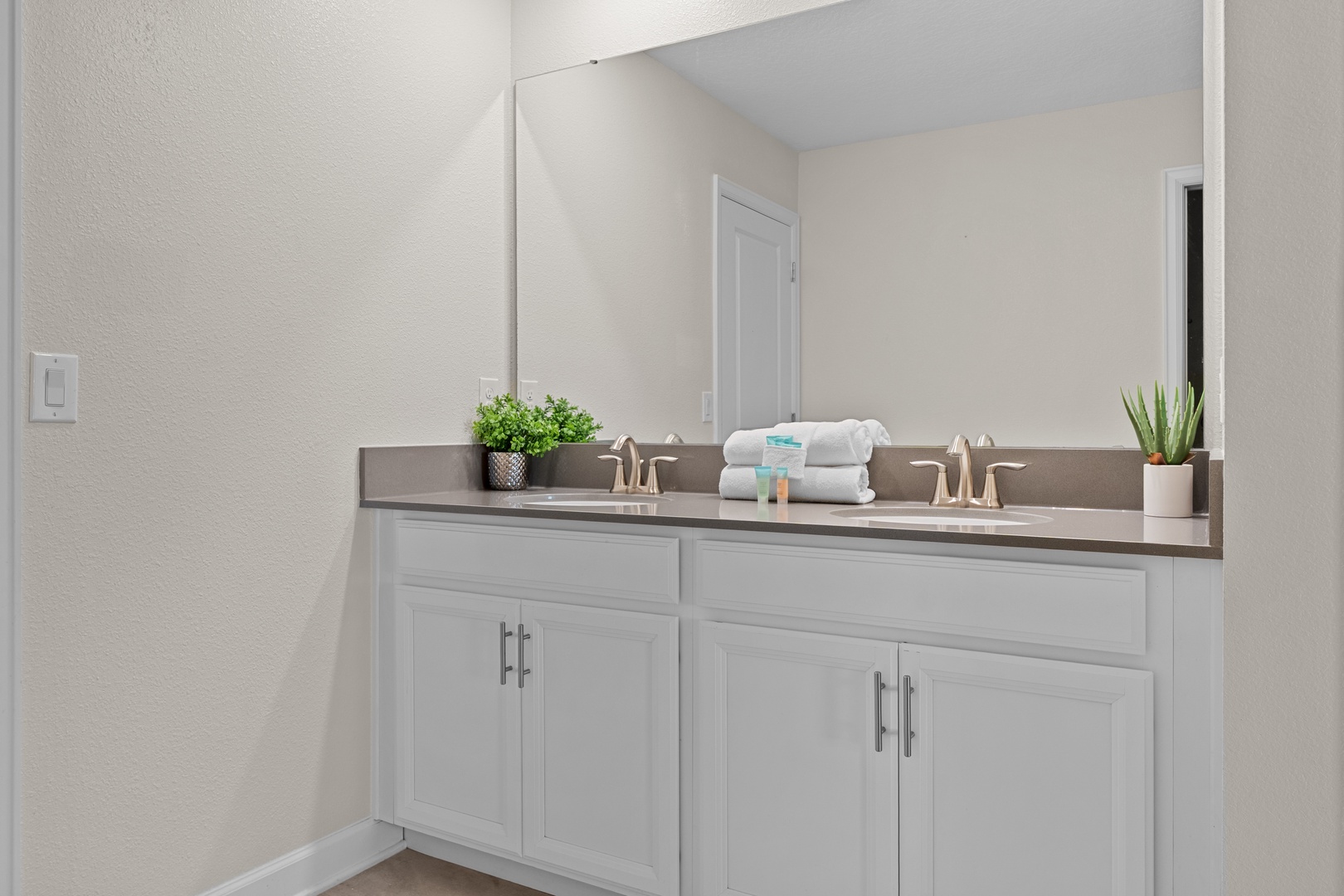 Your spacious dual-sink vanity offers plenty of room to get ready, with fresh towels and thoughtful touches awaiting your arrival.