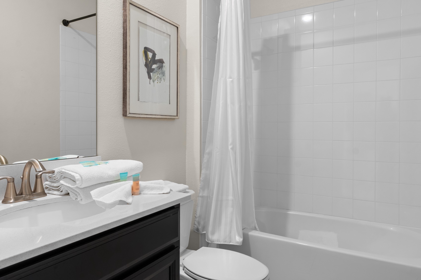 Step into your spotless bathroom with fresh towels waiting and a relaxing tub-shower combo for unwinding after exploring.