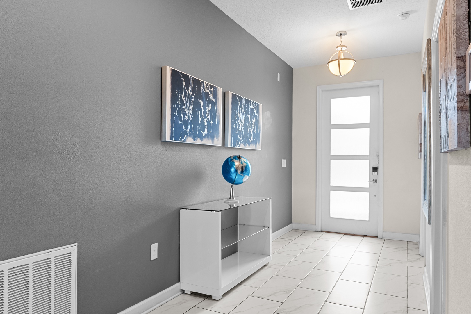 Step into your welcoming entryway with modern touches and stylish decor that sets the tone for your entire stay.