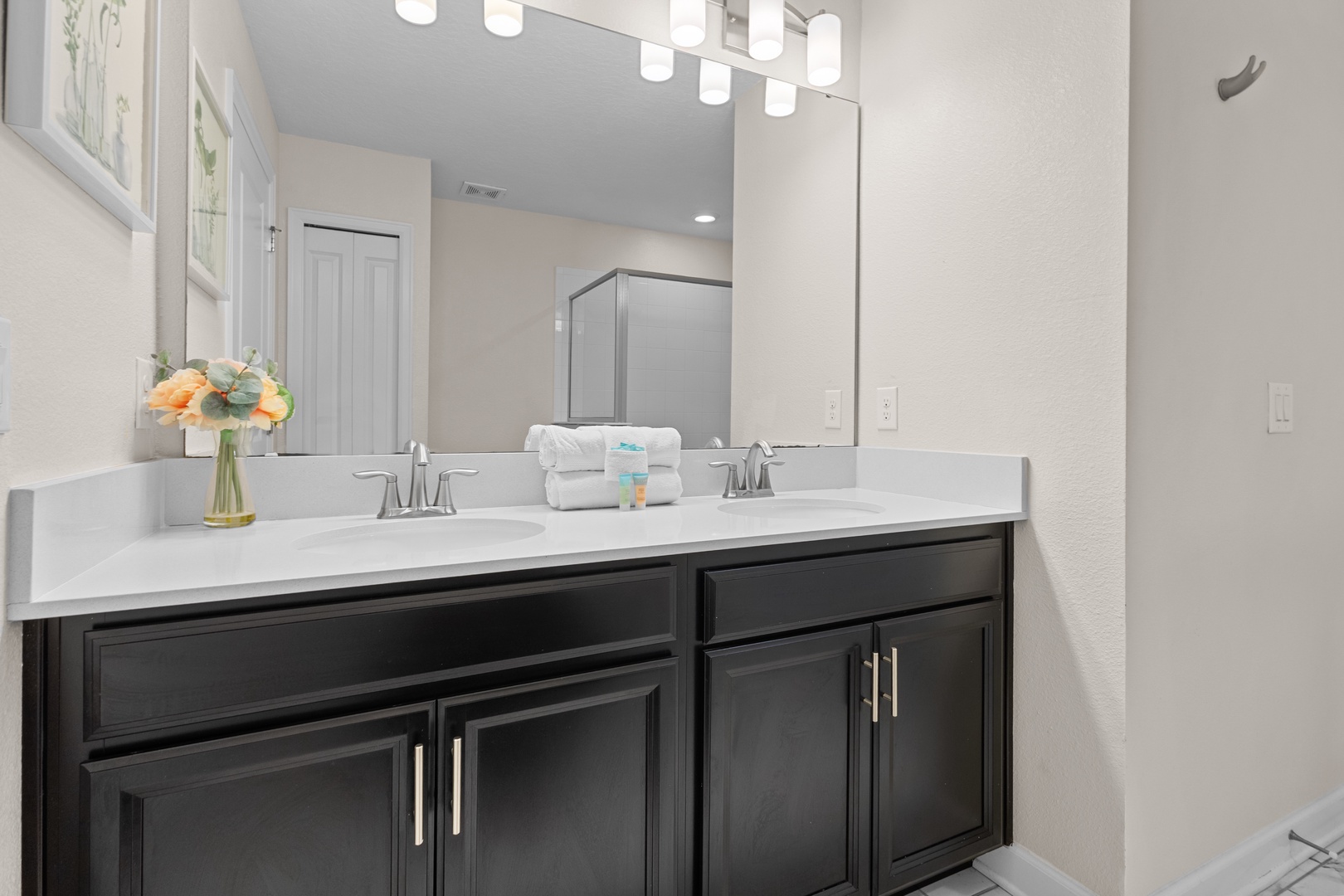 Freshen up in your elegantly designed bathroom featuring dual vanities, premium fixtures, and thoughtful amenities for your comfort.
