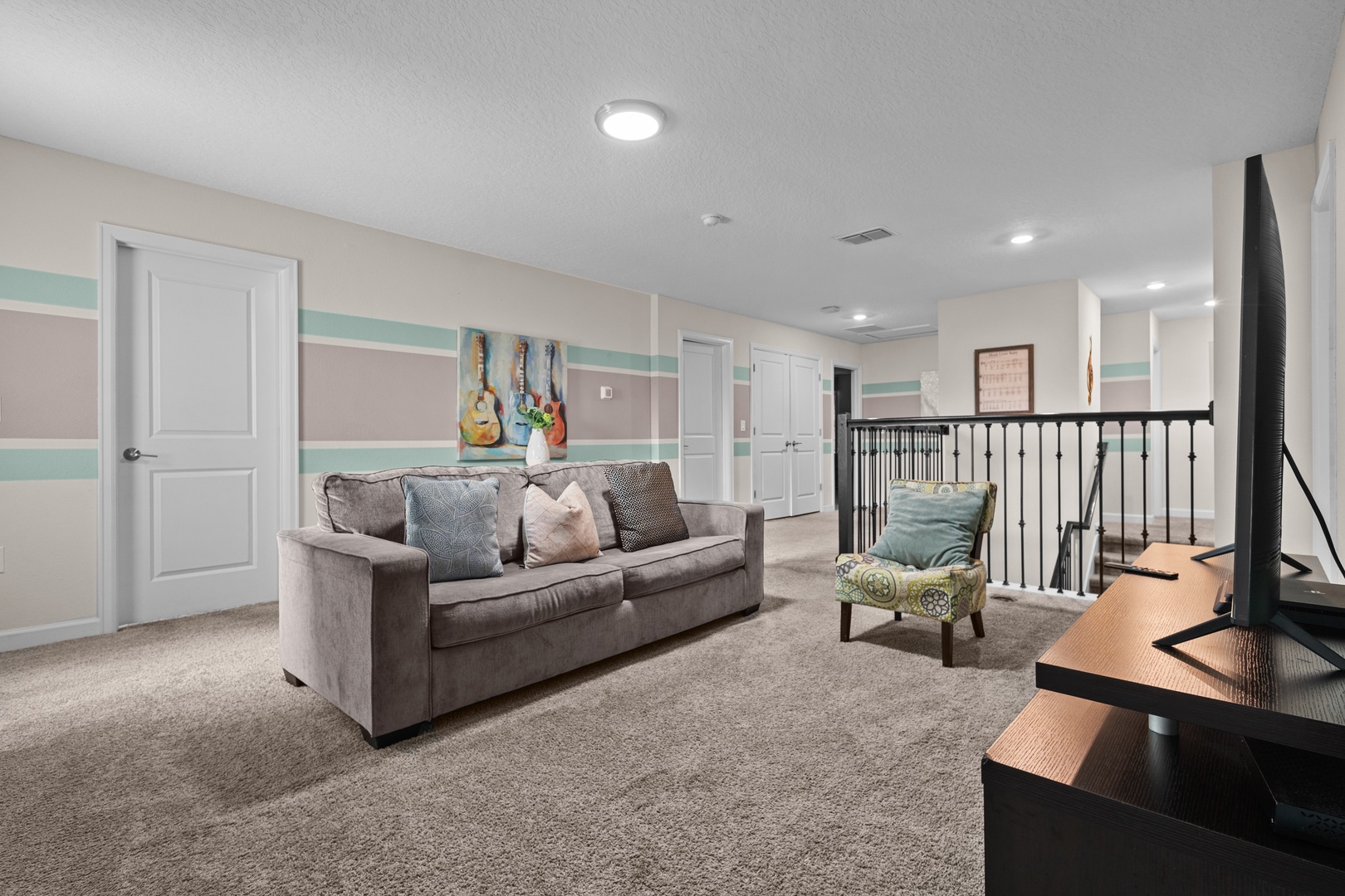 Unwind in your spacious upstairs living area with plush seating and cheerful décor—perfect for relaxing after exploring.