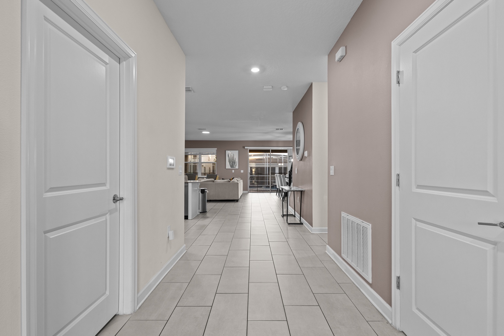 Step into your modern hallway where sleek tile floors lead to an inviting open-plan living space, perfectly designed for your comfort.