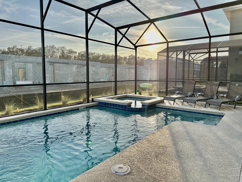 Relax in your private screened pool and spa while enjoying stunning sunset views through floor-to-ceiling glass.
