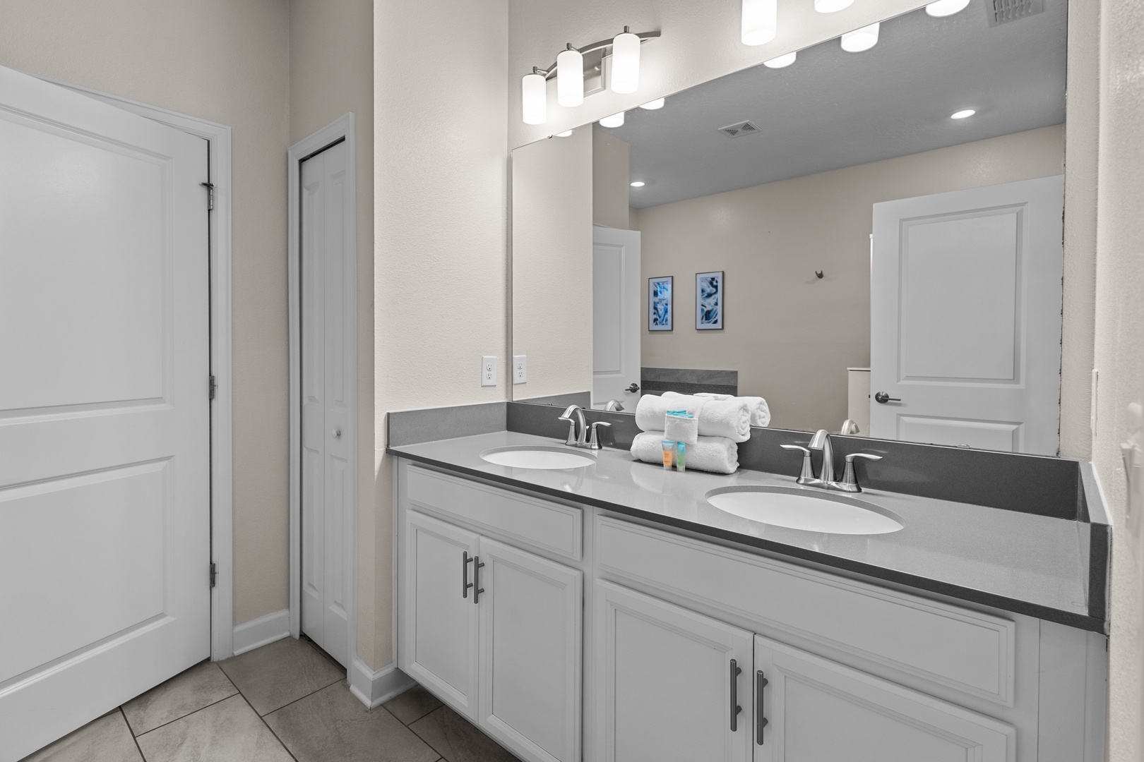 Freshen up in your elegant dual-vanity bathroom with bright lighting and premium amenities.