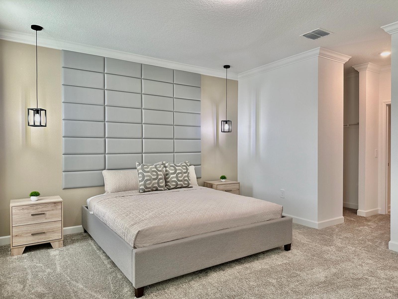 Sink into this luxurious bedroom where your comfort takes center stage. The plush king bed and sophisticated tufted headboard create your perfect sanctuary.