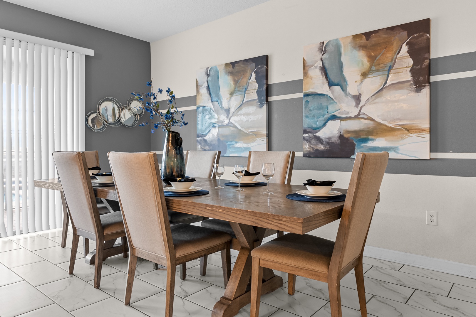 Your elegant dining room features beautiful artwork and natural light, perfect for memorable meals with loved ones.