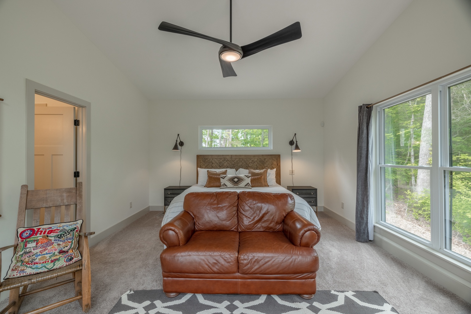 Bedroom 1 - 1 king sized bed, private bathroom, and sliding glass doors to the deck