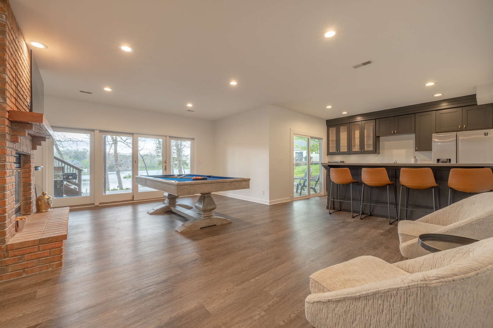 Enjoy an evening playing a game of pool and sipping cocktails in the spacious lower level living area