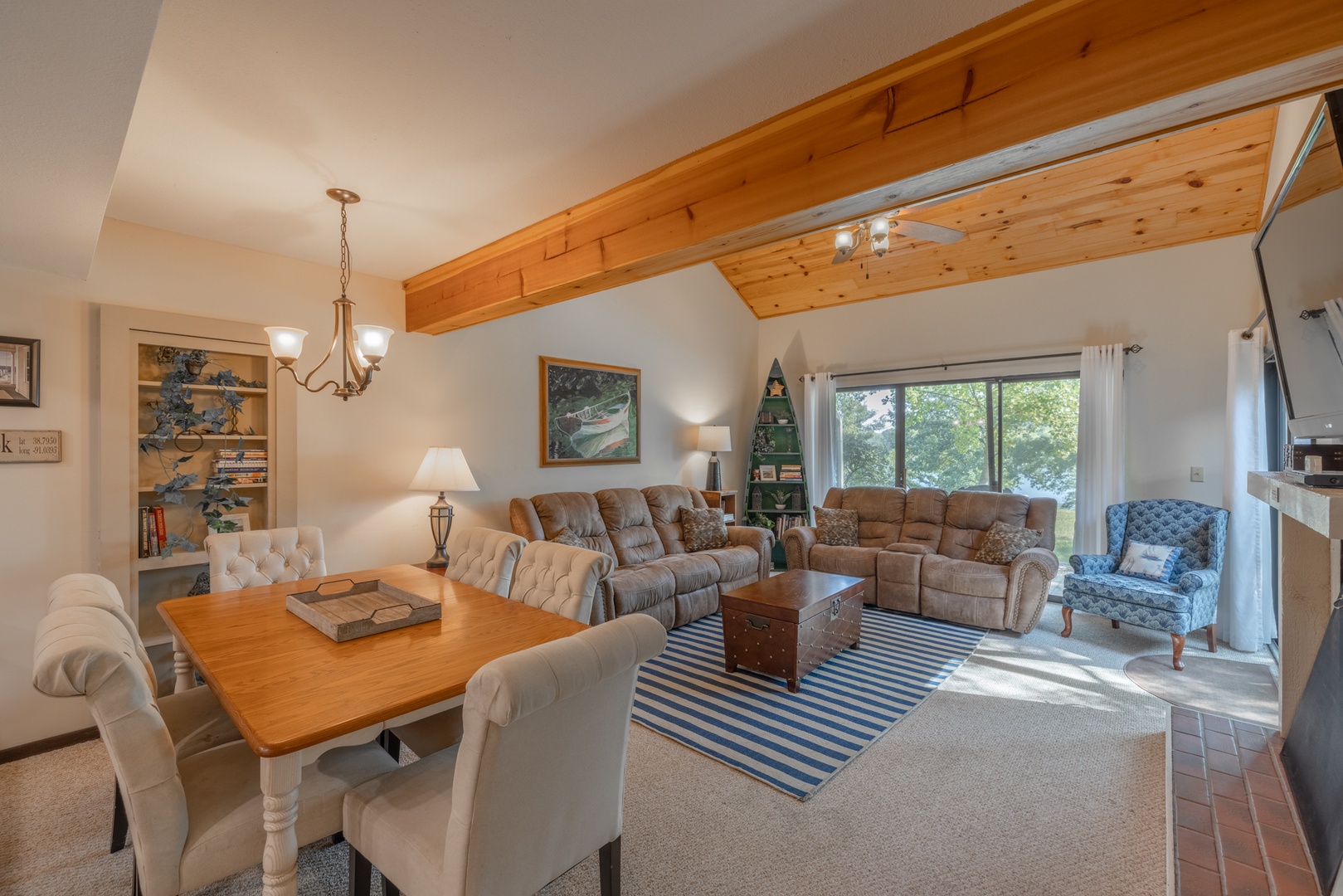 Beautiful, spacious living area with expansive sliding glass doors overlooking Lake Aspen!
