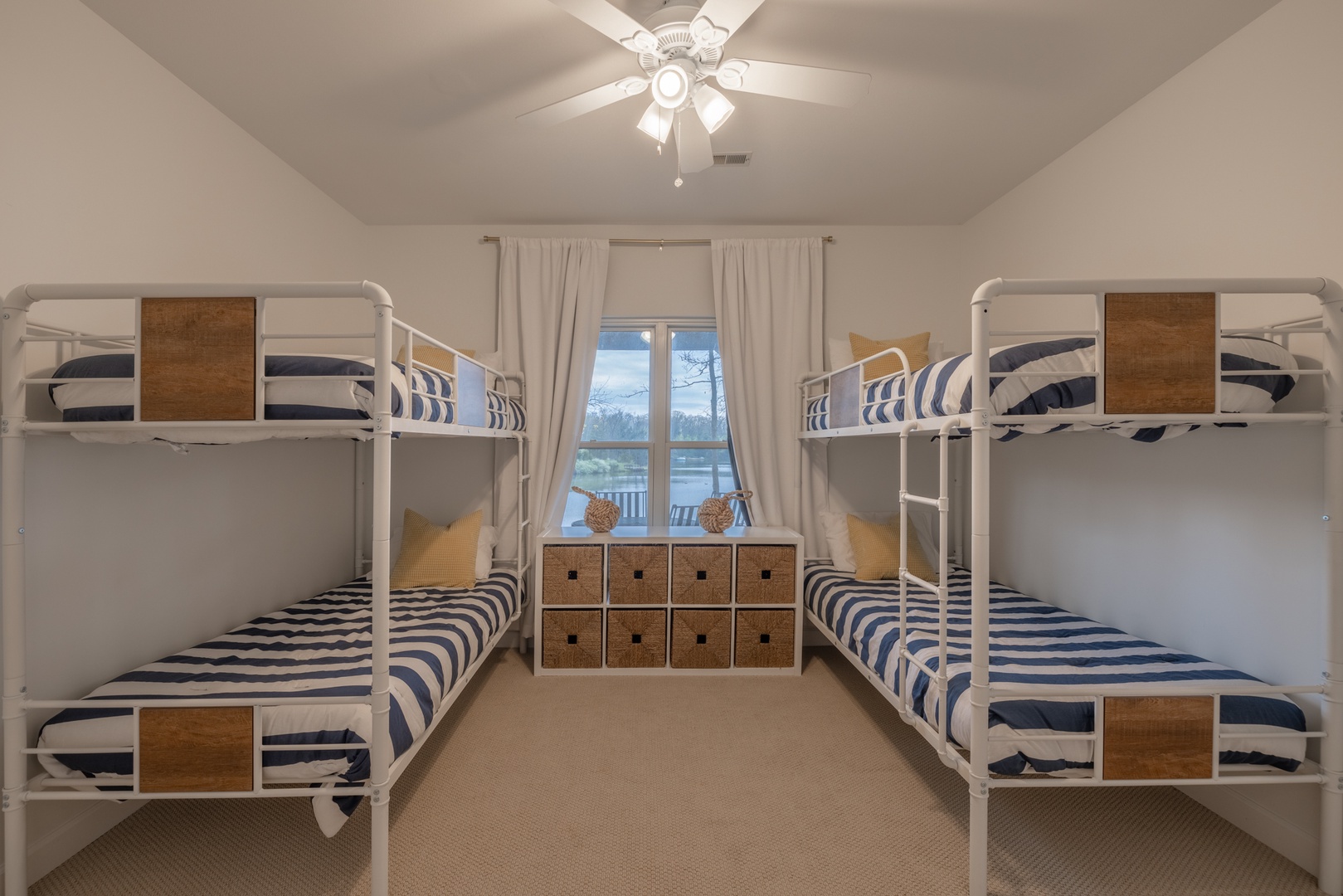 The bunk room is perfect for the kiddos or additional guests with two sets of twin over twin bunk beds