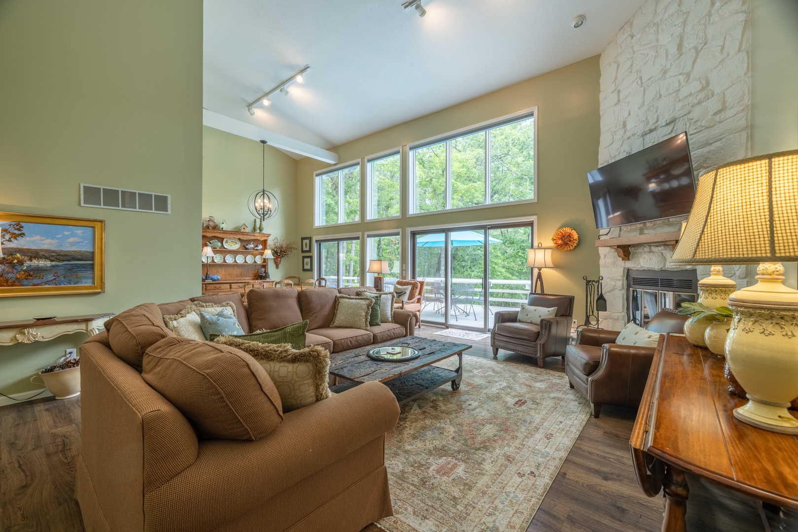 Enjoy spending time in the spacious living room with seating areas, surrounded by waterfront views