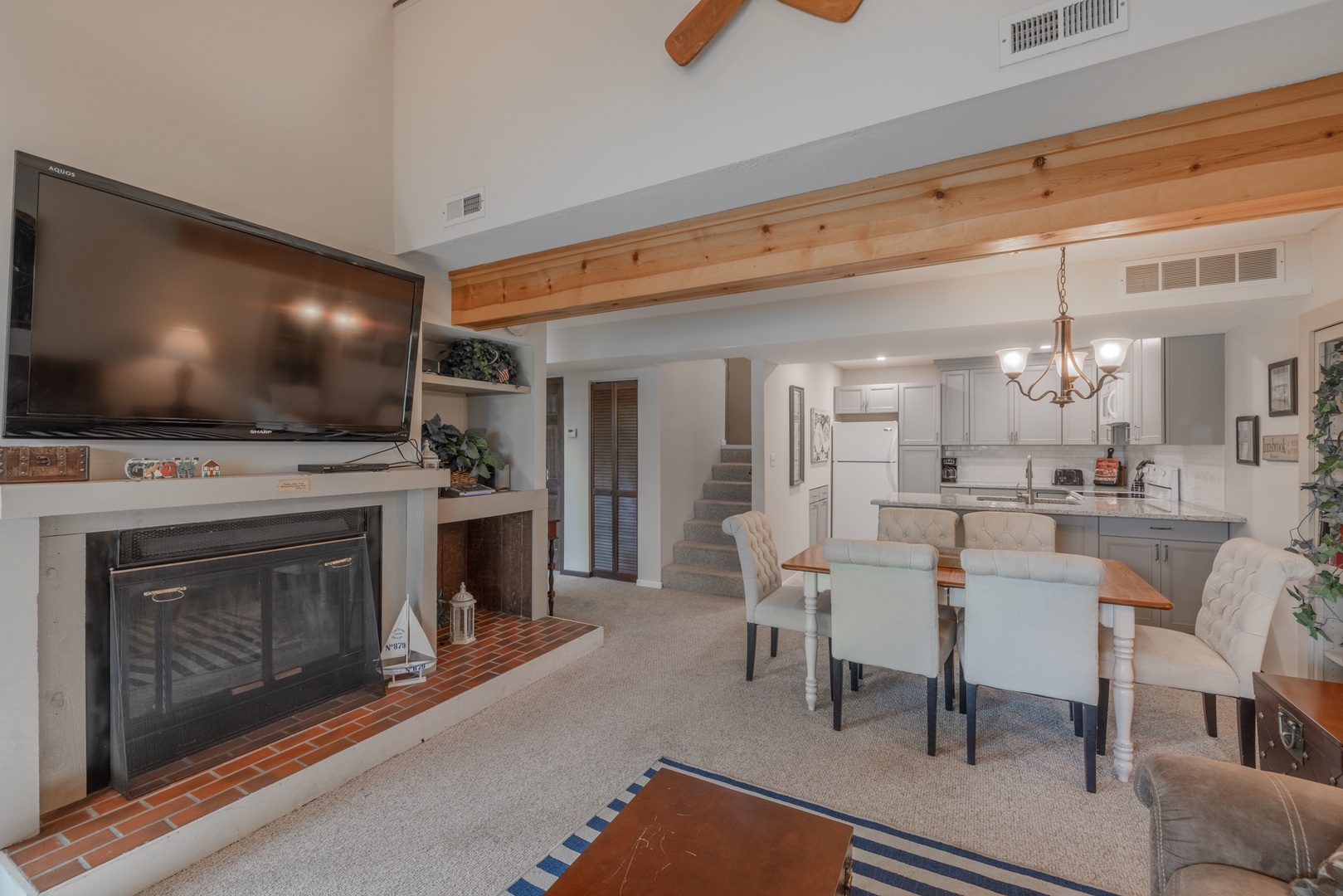 Wood-burning fireplace and new smart TV in the living area