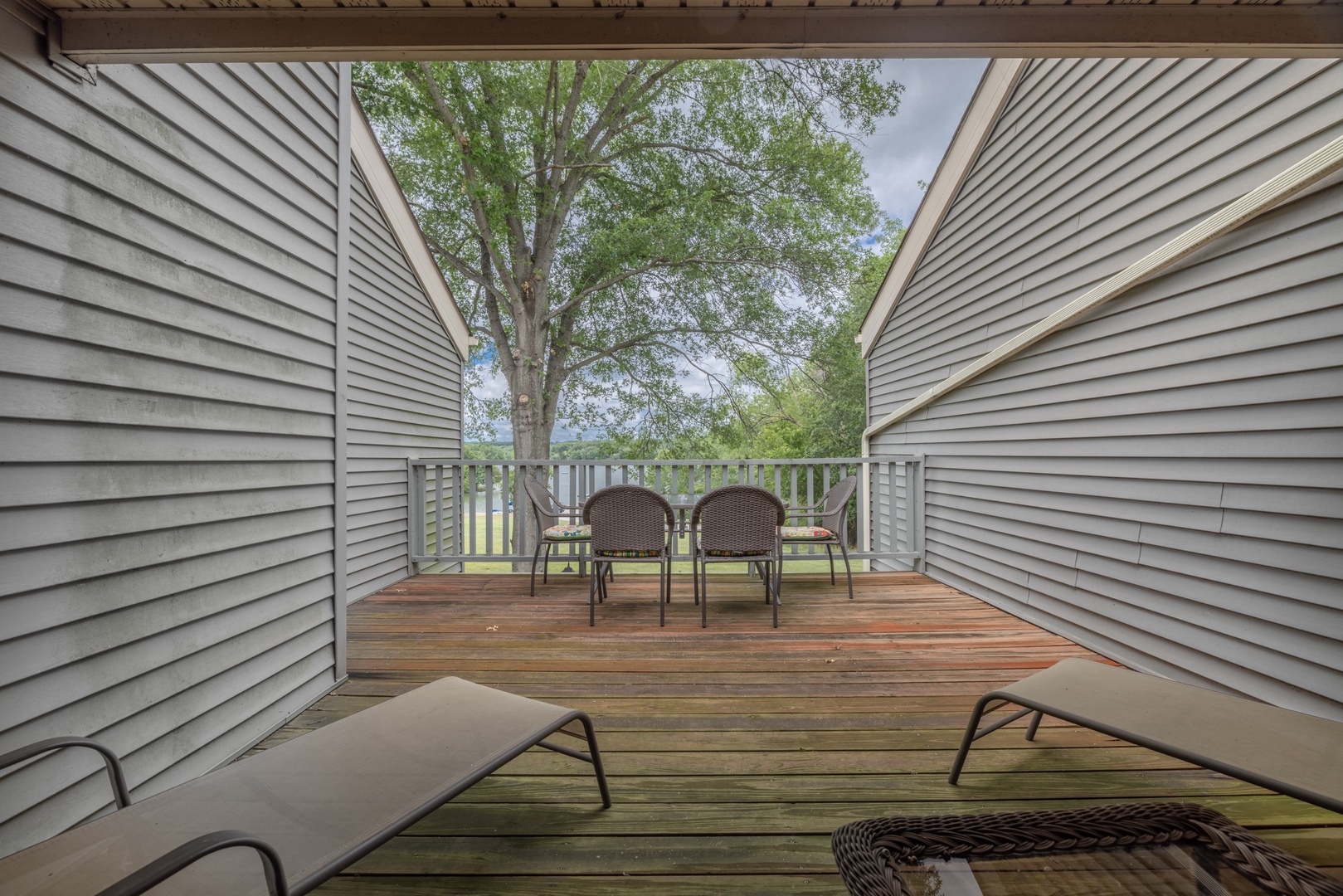 Private deck off of the second bedroom with patio furniture