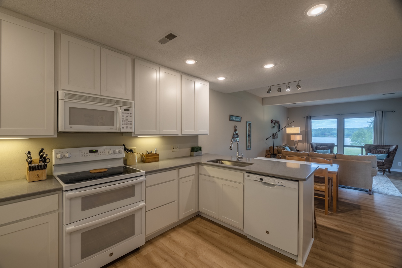 Open kitchen and dining space with breakfast bar and dining room table