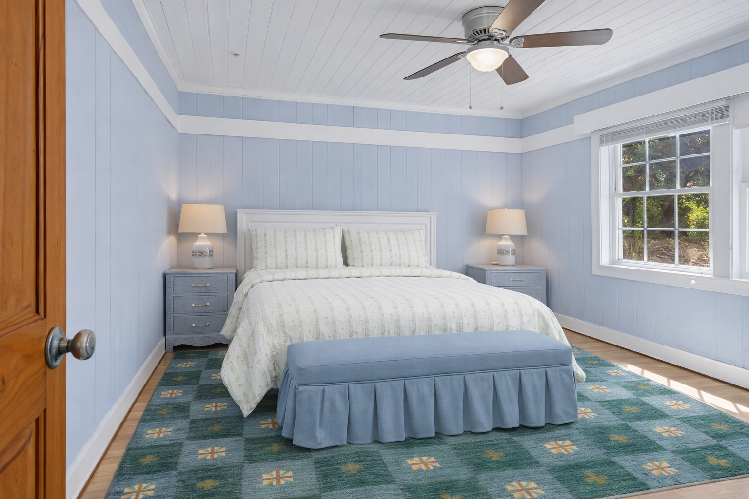 Drift off to peaceful sleep in your serene bedroom, where soft blue walls and crisp linens create the perfect coastal retreat.