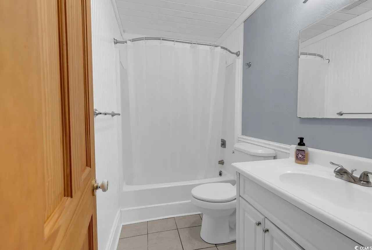 Your private bathroom features a relaxing tub-shower combo, vanity with ample counter space, and fresh linens for your comfort.