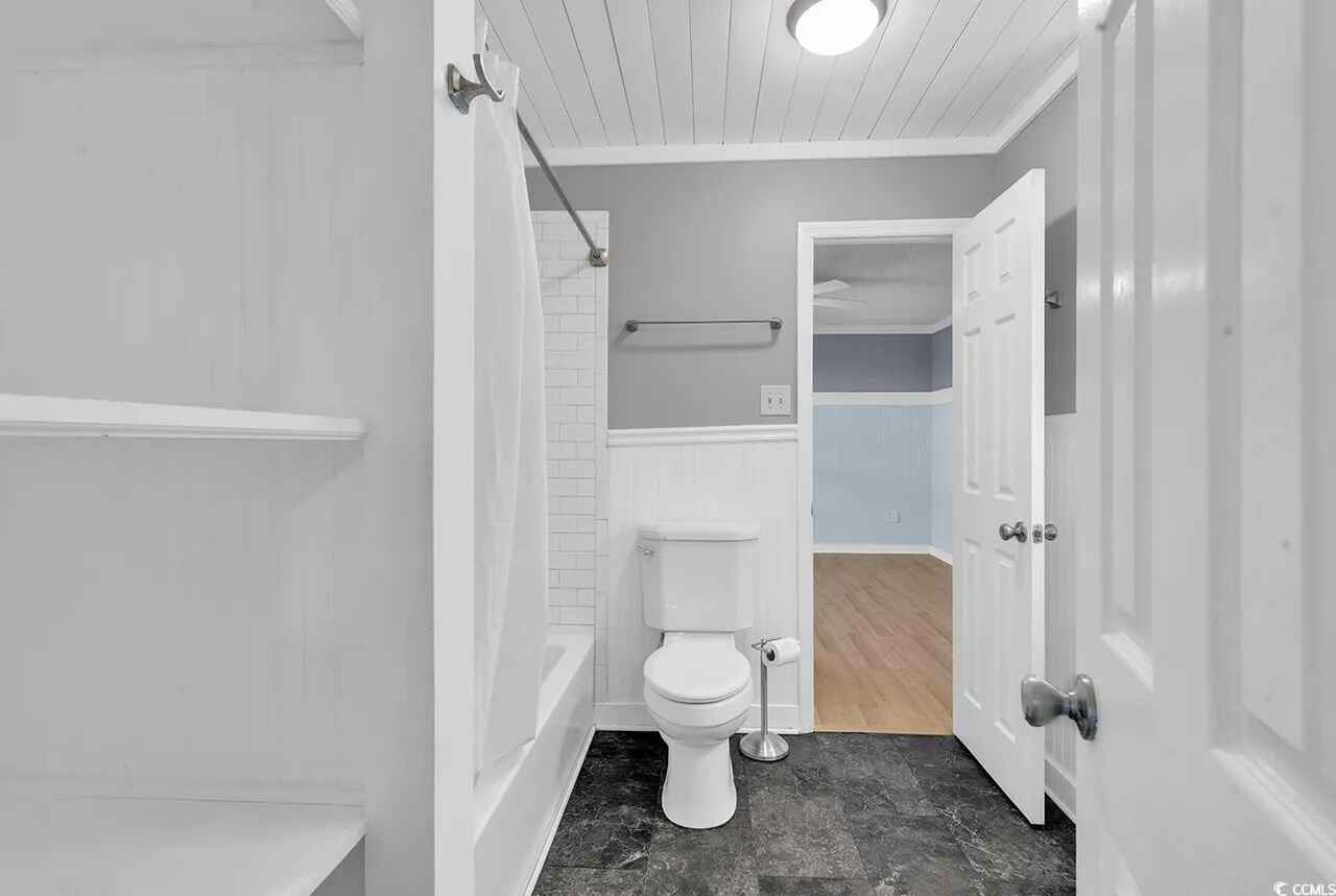 Your private bathroom features crisp white subway tile, modern fixtures, and thoughtful storage to keep your essentials organized during your stay.