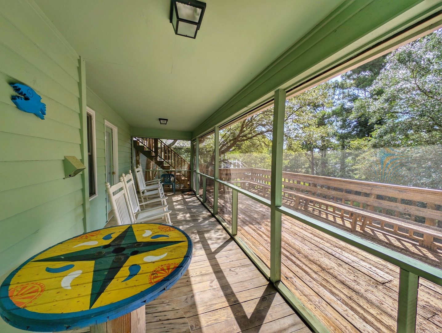 Relax in your private screened porch with rocking chairs and serene treetop views—perfect for morning coffee or unwinding after a day of exploring the area.