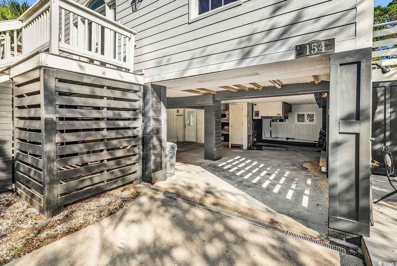 Covered garage space with convenient storage and laundry access makes settling in effortless.
