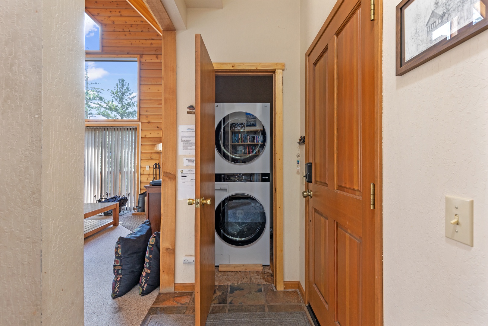 Laundry closet with stacked washer and dryer