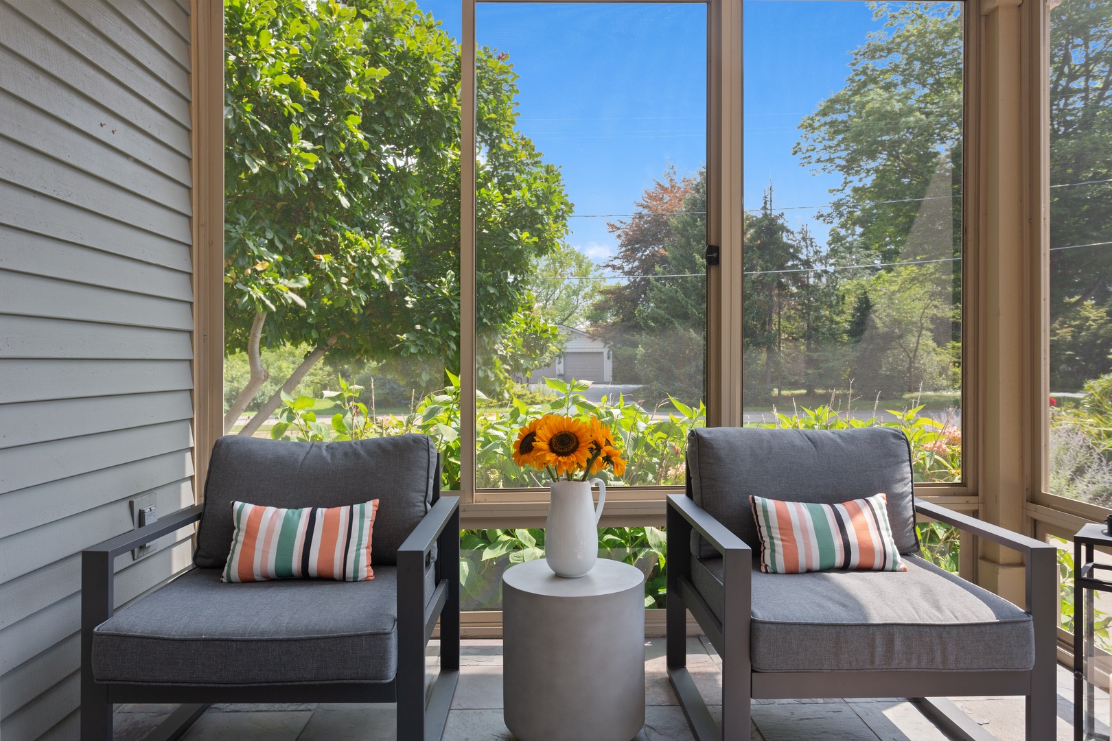 This spot in the sunroom is ideal for morning coffee.