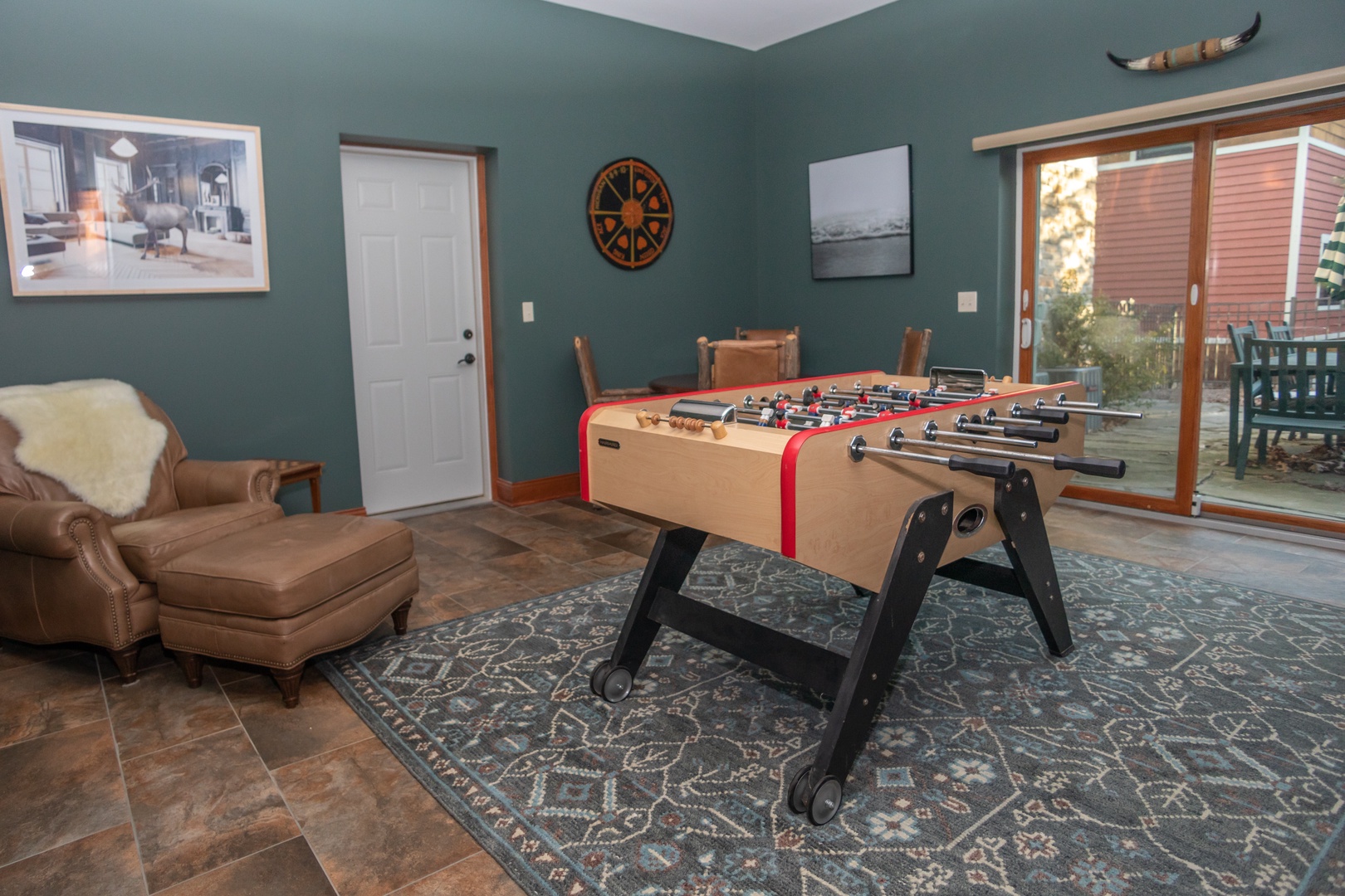 A game room with foosball table and other activities provides entertainment for everyone.