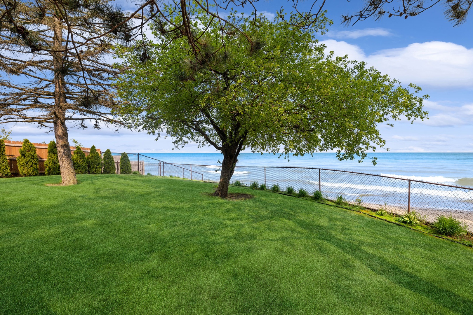 The private backyard offers unobstructed views of the lake.