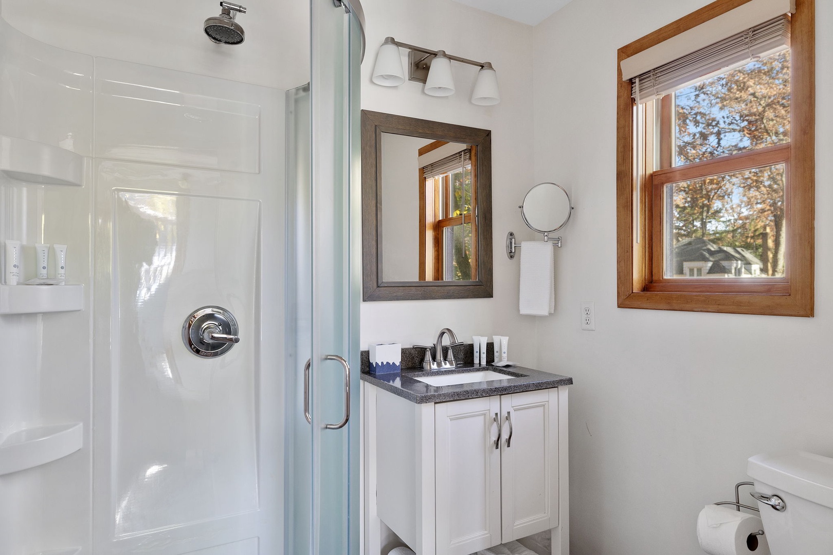 Besides the walk-in shower, a stone-top vanity always adds a touch of elegance.