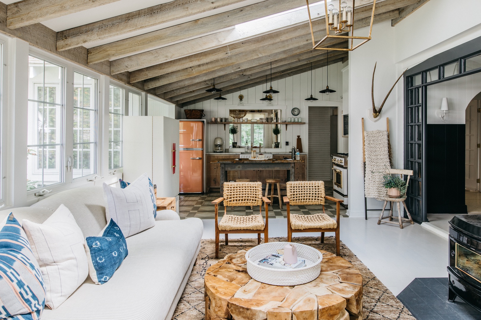The main living area features vaulted ceilings and rustic exposed beams.