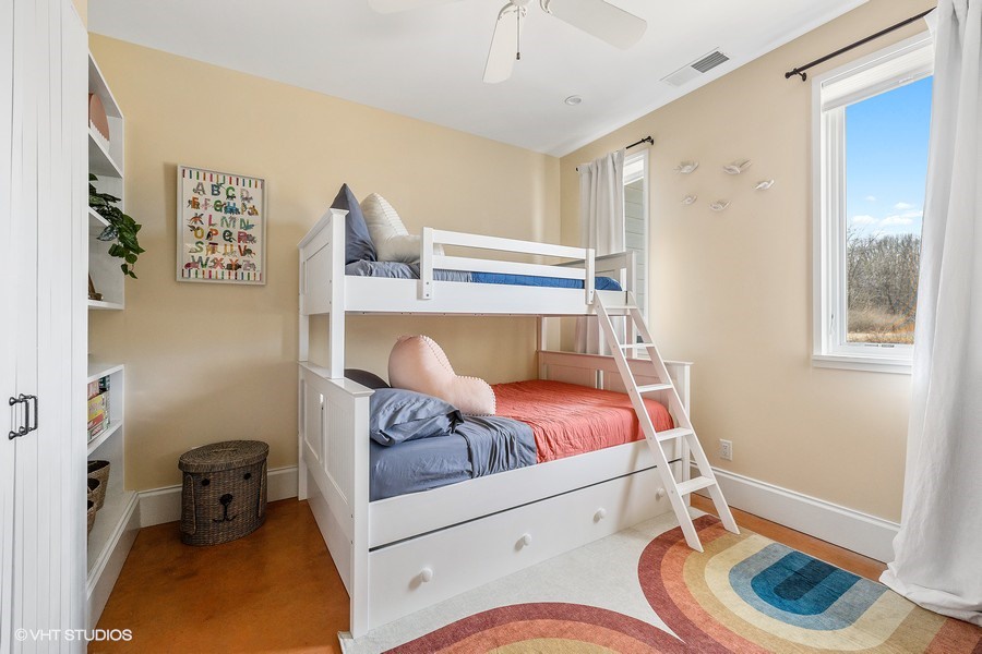 There is enough room for everyone here with a super cool bunk bed that has a twin, one full, and one twin trundle