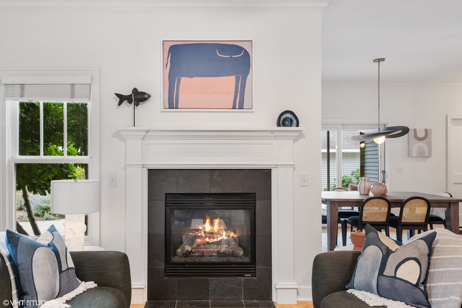 The chic living room with a gas fireplace is ideal for snuggling on chilly evenings.