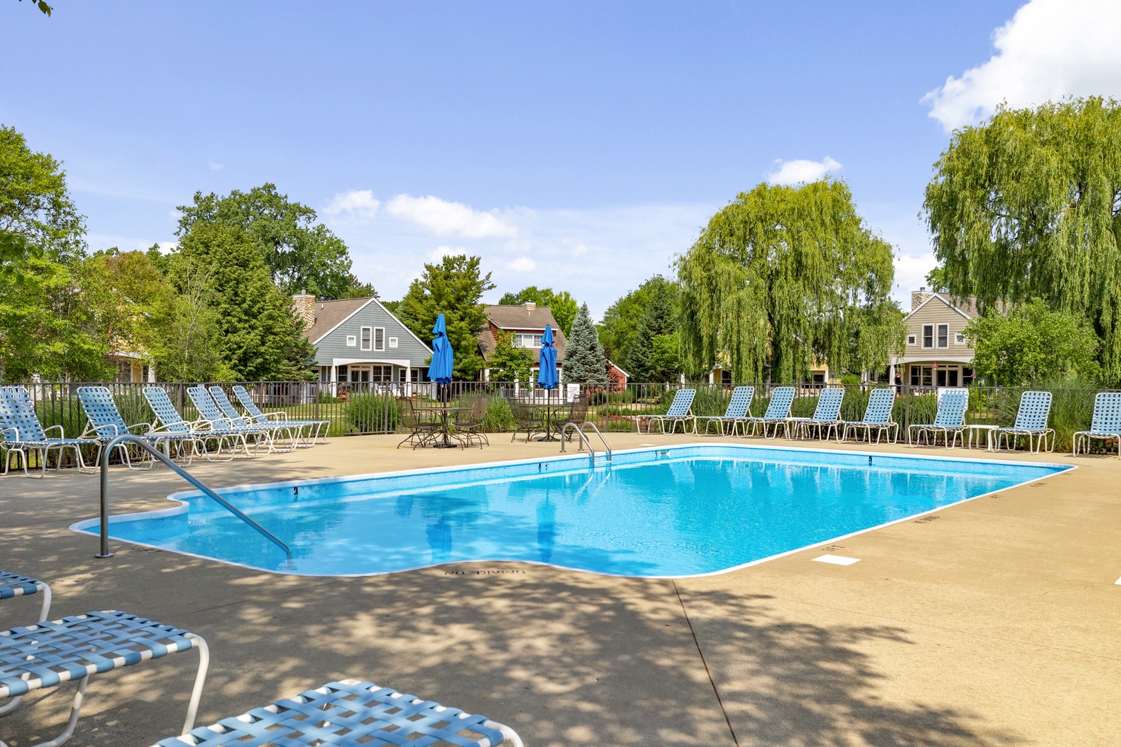 A community pool, chaise lounges and warm sun quickly get you in vacation mode!