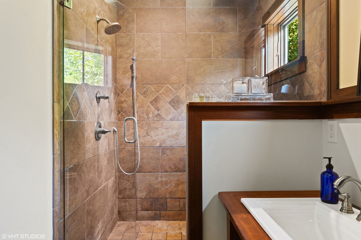 Experience spa-level luxury in the primary bath's statement shower.