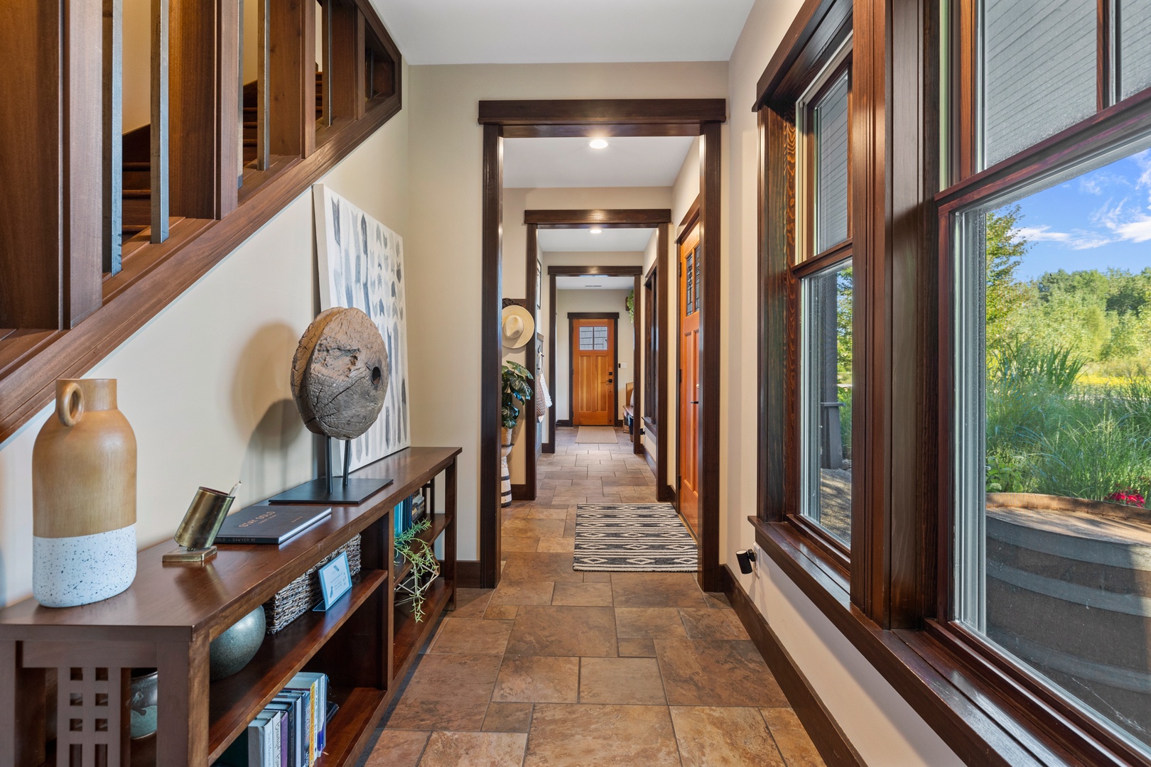 Panoramic windows, 10’ ceilings and stone-tiled radiant flooring are found throughout the residence.