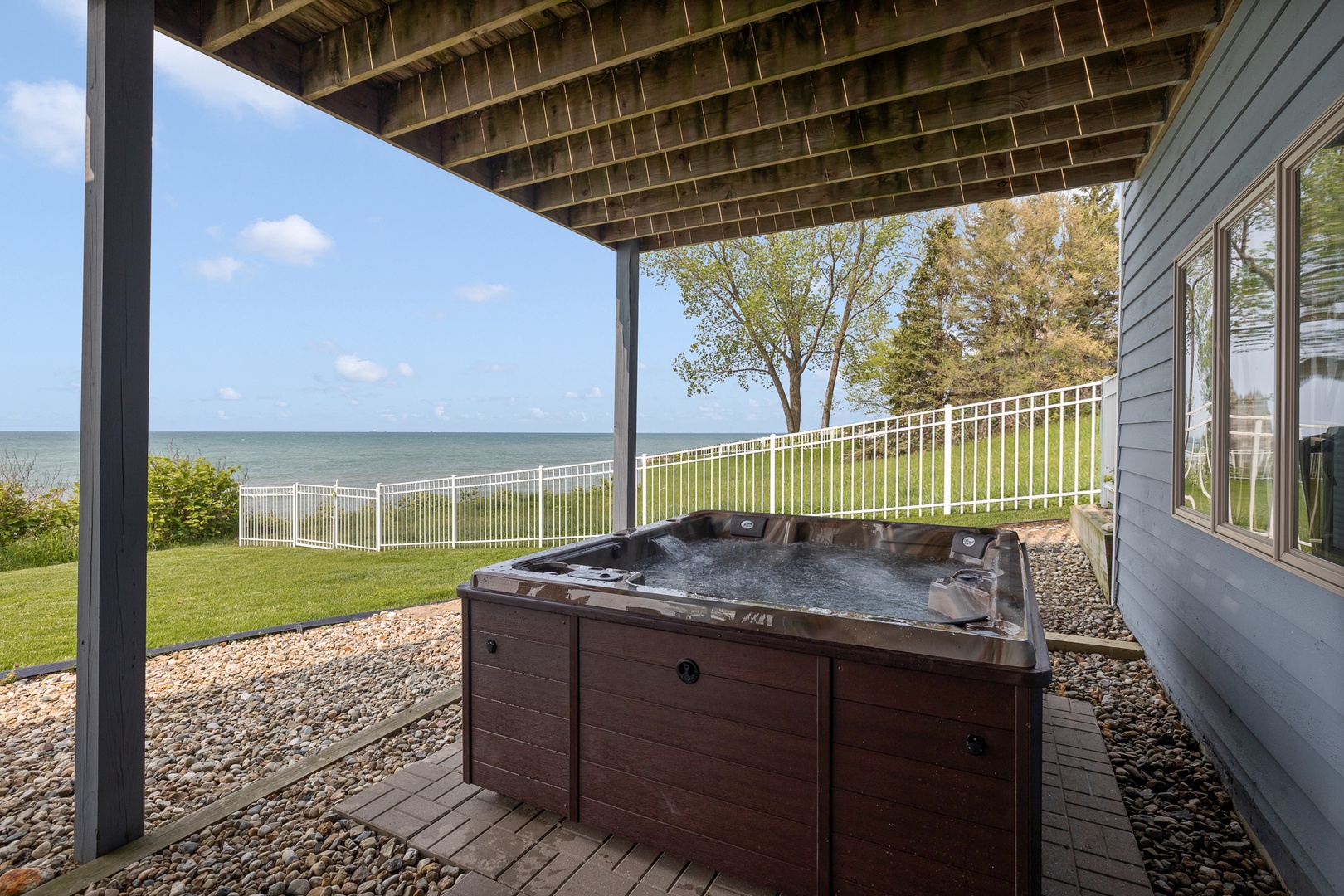 Coastal Escape offers the ultimate vacation with 2 hot tubd and lake views.