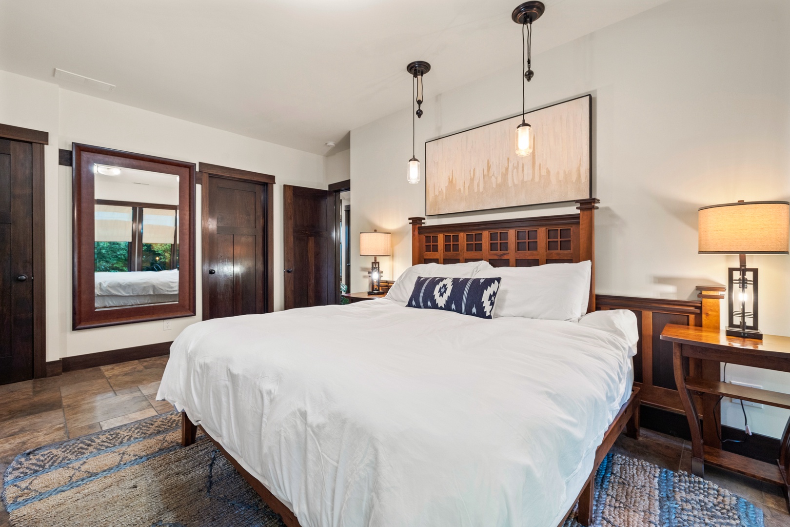 A king bed in the primary bedroom provides a luxurious sleep after a full day of travel.
