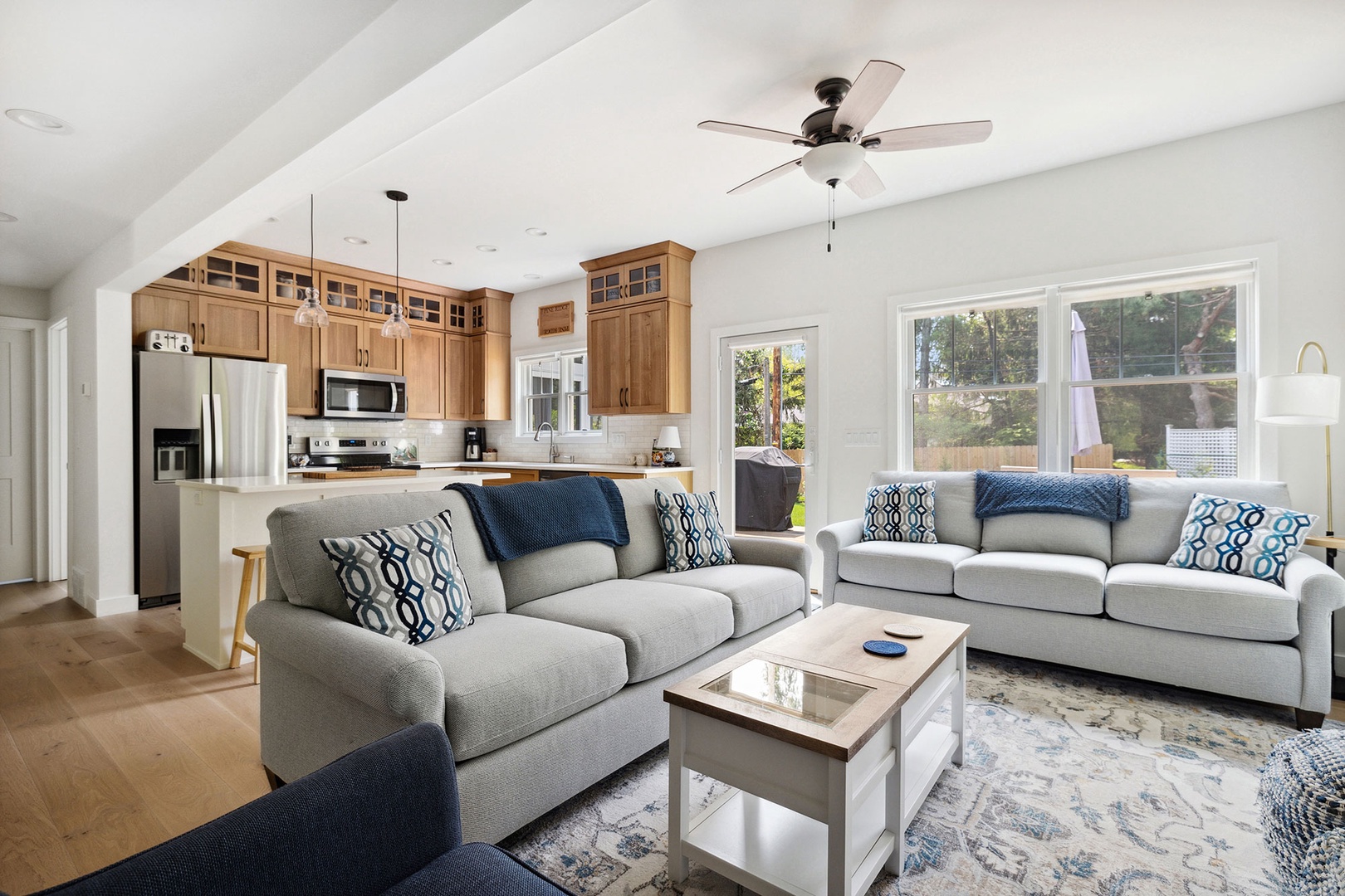 The open living area lets everyone feel together, from the cozy seating to the modern design.