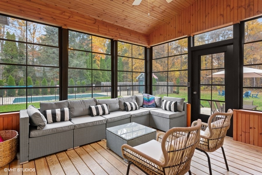 Fashionable seating provides great views of the massive backyard and surrounding trees.