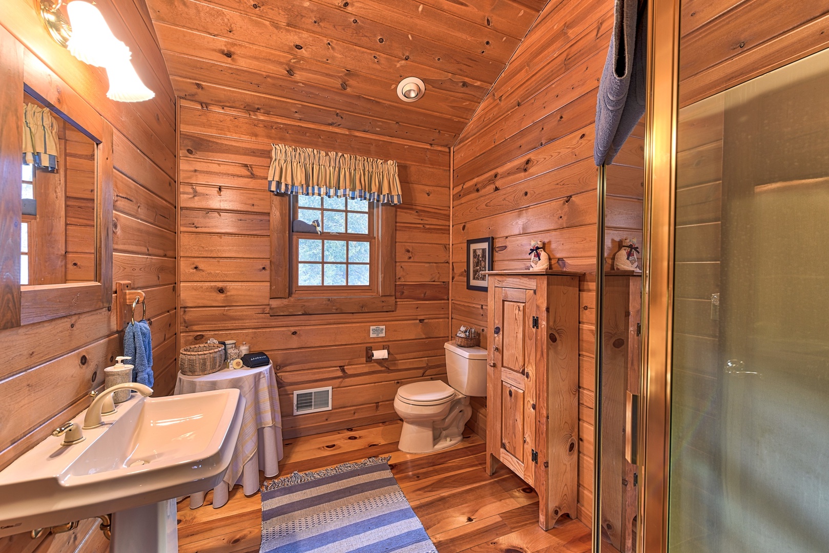 Immerse yourself in the cozy charm of this bathroom.