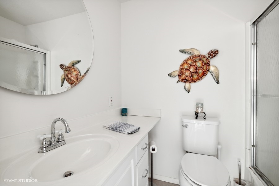 Clean up after a long day of vacation fun in this spacious bathroom.